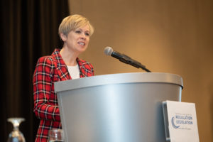 photograph of Julie Maciura at podium