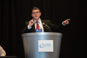 photograph of David Benton at podium