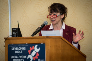photograph of Lynn King at podium