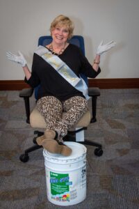 Photograph of Mary Jo Monahan sitting in an office chair