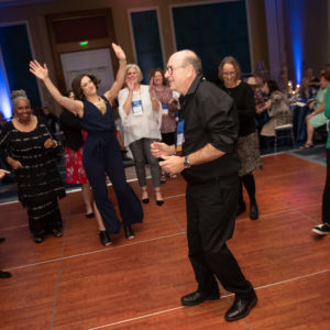 photograph of Claude Savoie dancing on a dance floor