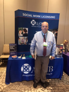 photograph of Joe Harper in front of the ASWB booth