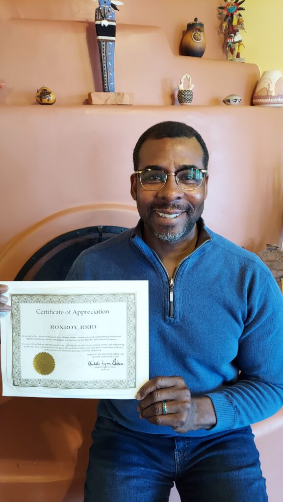 Roxroy Reid holding certificate