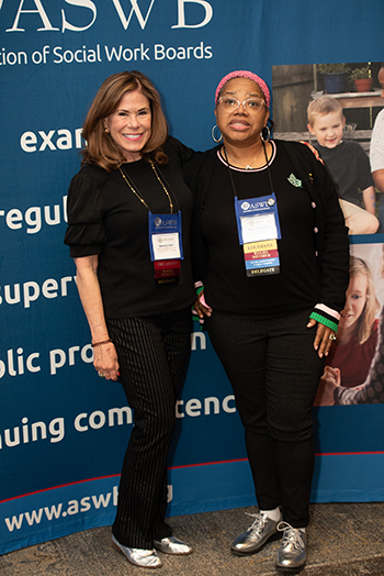 Photograph of two women wearing nearly identical outfits.