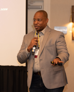 Photo of Onoriode Evwaraye speaking at the 2026 ASWB Education Meeting.
